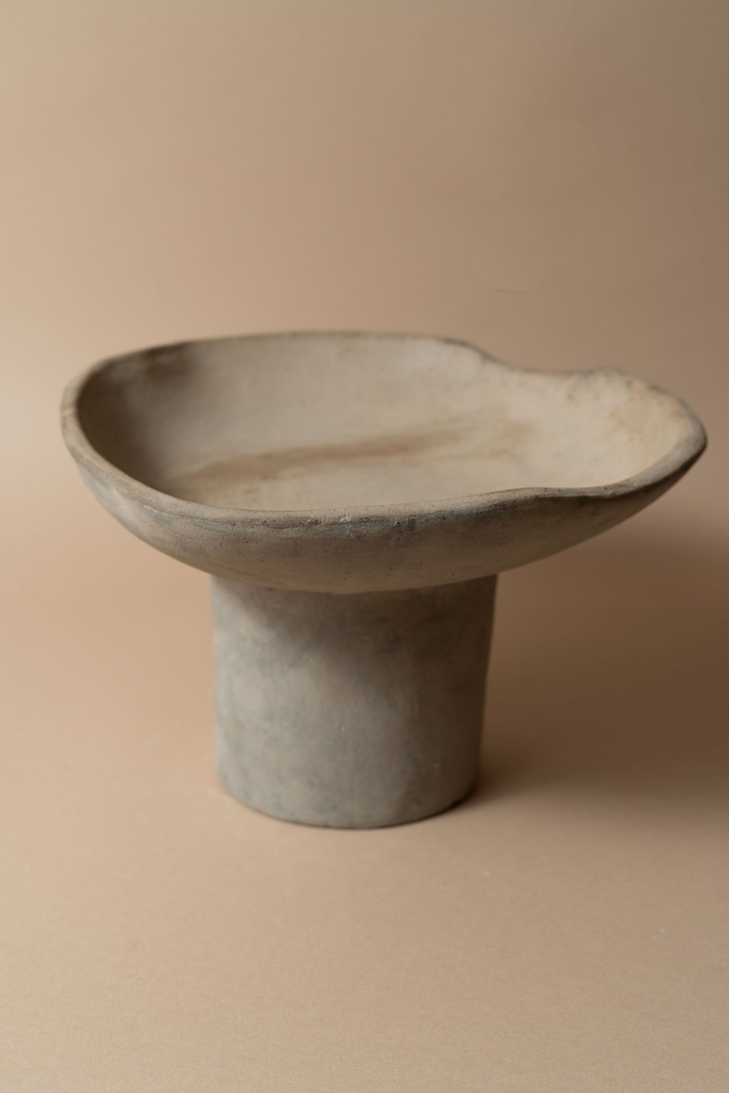 Terracotta pedestal bowl with a tall foot