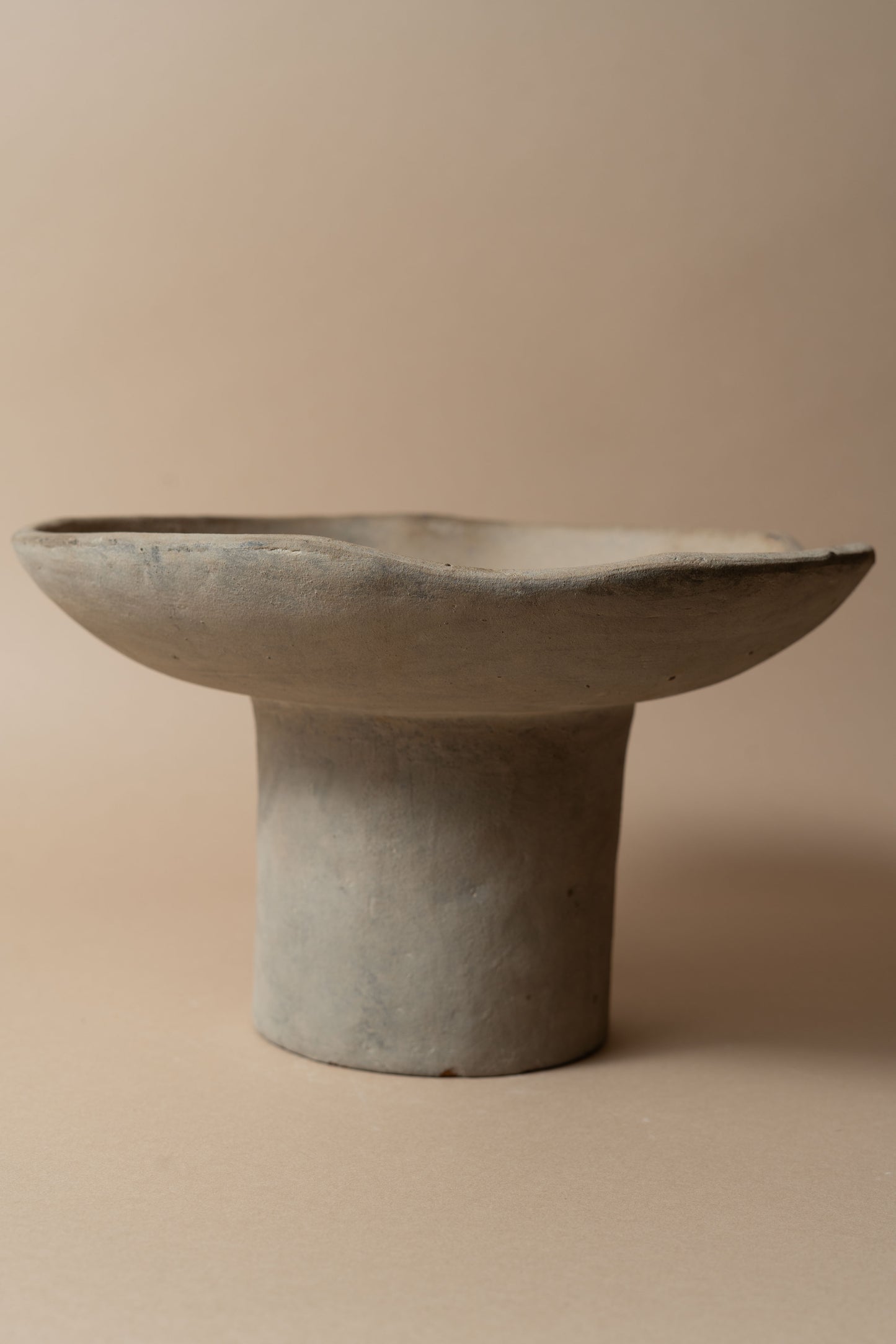 Terracotta pedestal bowl with a tall foot